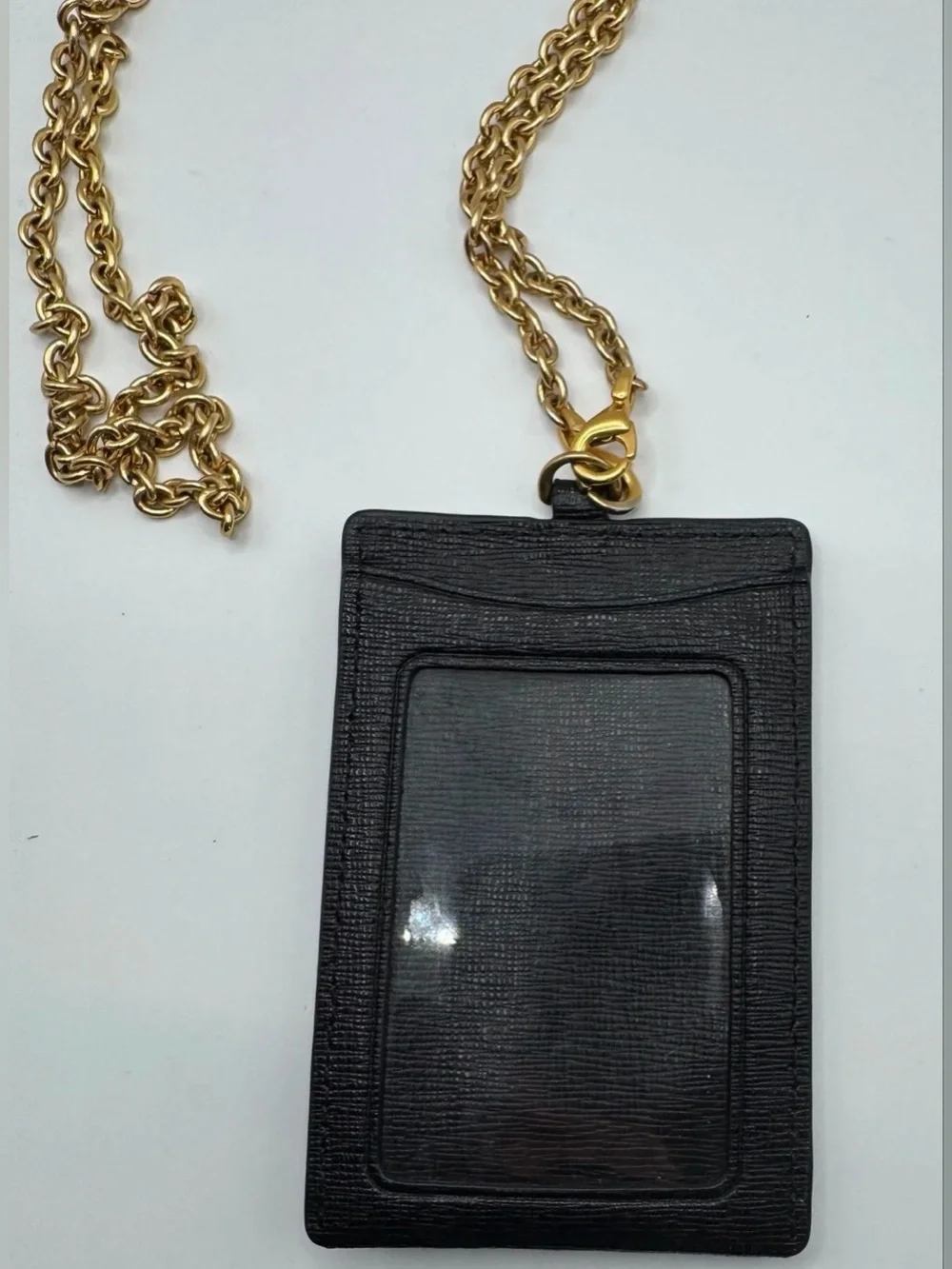 Kate Spade lanyard is holder black gold chain